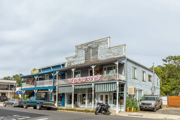 Jamestown, USA - June 3, 2022: old historic building with typical 2 storage  architecture  and wooden facade with balcony in Jamestown, California.