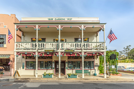 Jamestown, USA - June 3, 2022: old historic building Carboni from 1859 with typical 2 storage  architecture  and wooden facade with balcony in Jamestown, California.
