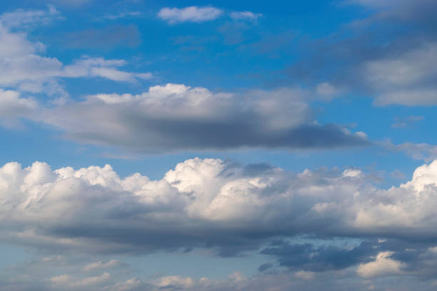 istock Dramatic blue sky and warm light clouds at sunrise time. 1417858276