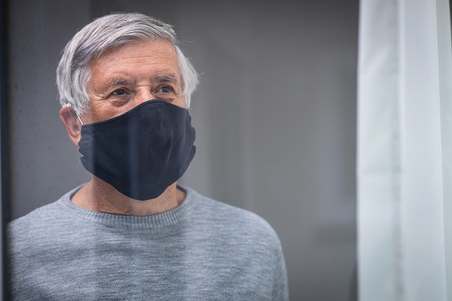 Senior man wearing protective face mask