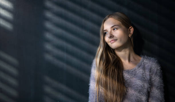 istock Pretty, young female student in front of a blackboard 1417859896