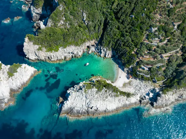 Aerial view of the secluded Spilia Beach at the rough and cliffy east coast of Skopelos island, Sporades, Greece