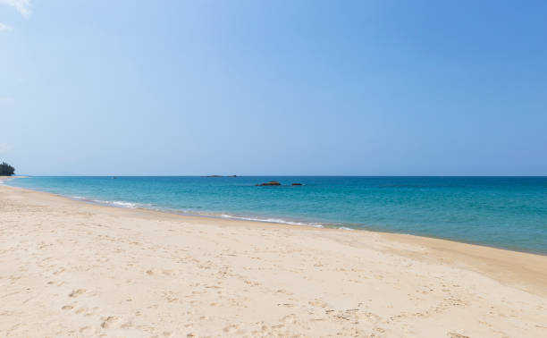 istock Fine sandy beach with blue sea background 1417863092