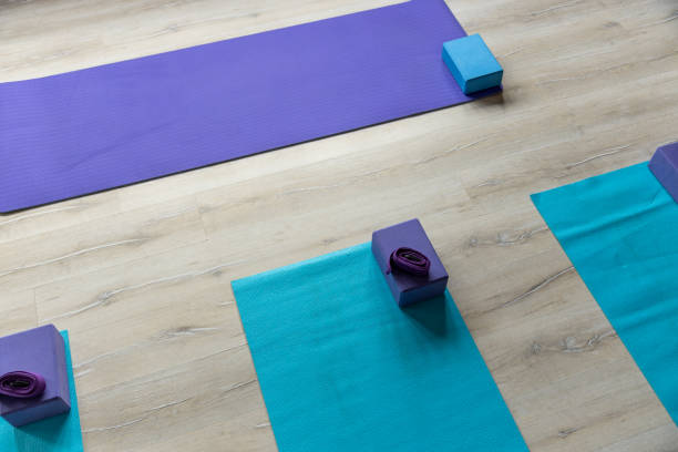 istock Yoga mats with blocks and belts placed on floor in studio 1417864543