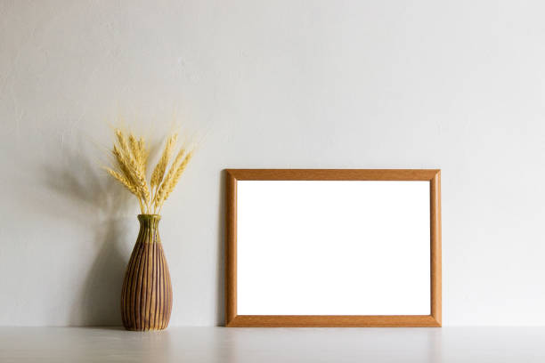 istock Brown flowers with brown frame over the table with natural light. 1417865272