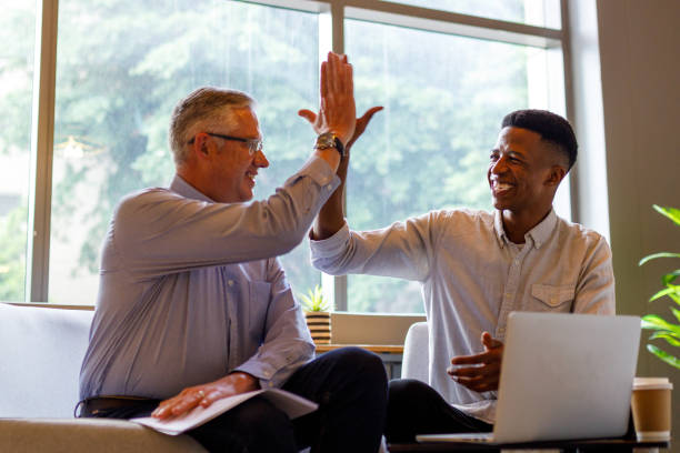 istock Male partners giving high five while celebrating growth 1417866380