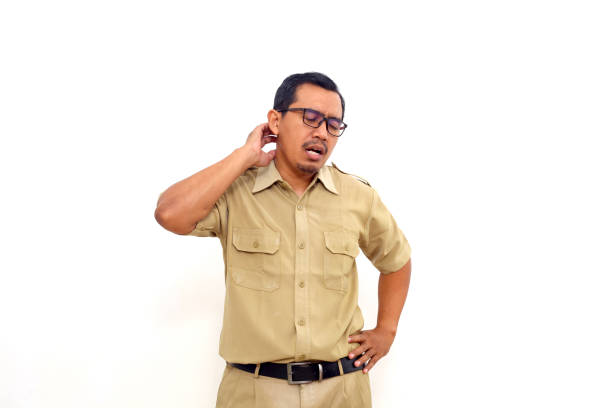 Indonesian government employees standing with tired gesture. Isolated on white