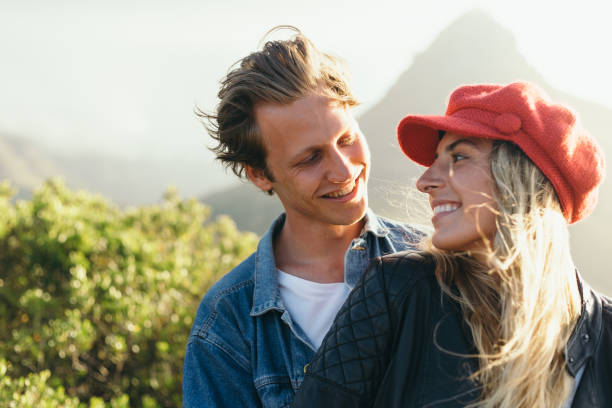istock Happy couple looking at each other while enjoying weekend 1417867486