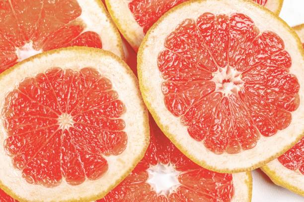 istock Texture of ripe grapefruit slices for backgrounds 1417869580