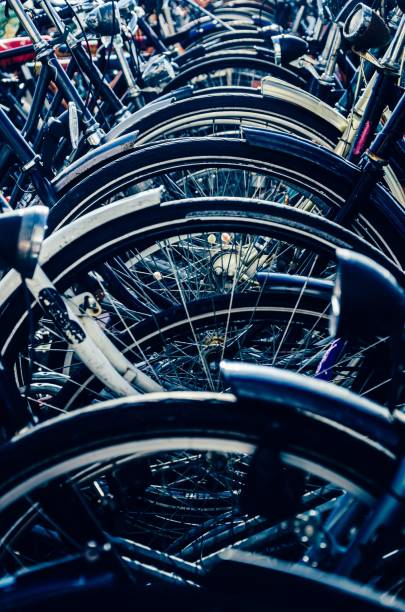istock Vertical shot of parked bicycle wheels pattern 1417869879