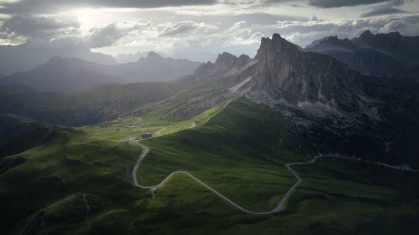 istock River passing through the green fields with rocky mountains in the background 1417870147