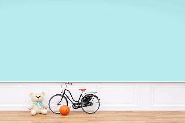 istock Kid playroom with teddy bear and a child bicycle. 1417870736