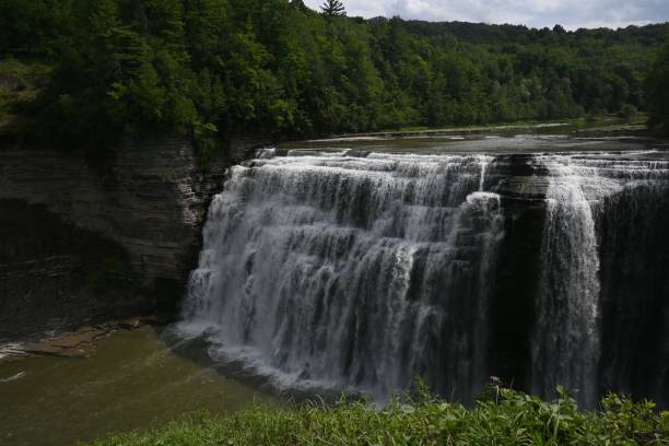 istock Wonderful waterfall deep in the forest on a gloomy day 1417872368