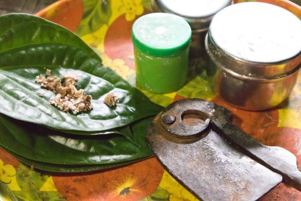 istock Betel leaf and its ingredients for flavoring in chewing areca nut (betel nut chewing) 1417873432