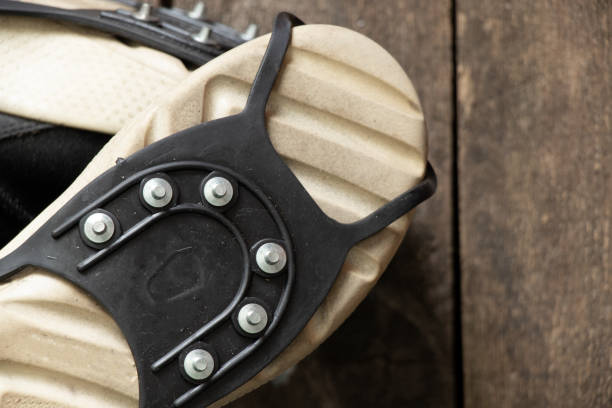 istock ice access on shoes, protection against slipping on ice 1417877440