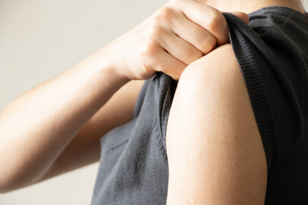 istock female shoulder on isolated light background,health 1417877967