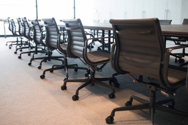 istock Modern interior design for an office with a long table and chairs 1417880125