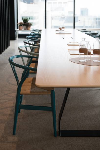 istock Vertical of modern interior design for an office with a long table and chairs 1417880140
