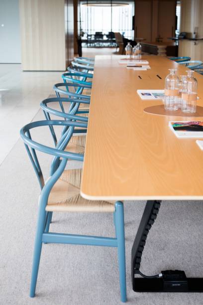 istock Vertical of modern interior design for an office with a long table and chairs 1417880150