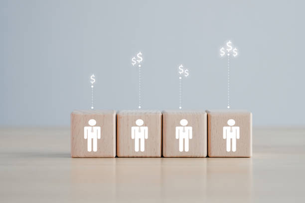 istock Employee with different salary. Income. financial inequality. rich and poor metaphor. difference job salary. Human icon on wooden block and dollar sign. 1417884401
