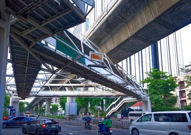 Triangular pedestrian overpass at the mouth of Soi Aree Intersection, Phahonyothin Road, Bangkok, Thailand, April 28, 2022