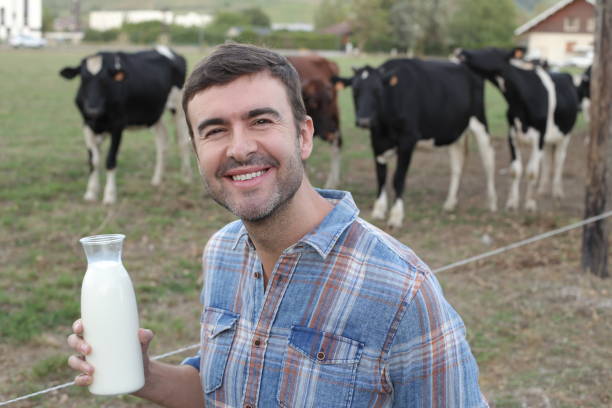 istock Farmer holding fresh bottle of milk 1417888880