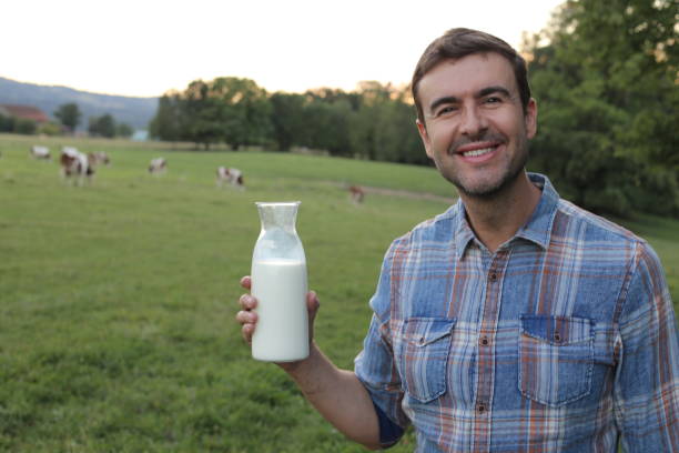 istock Farmer holding fresh bottle of milk 1417888911