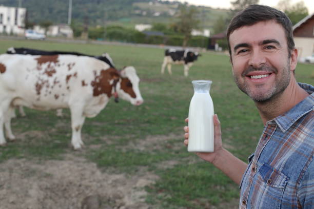 istock Farmer holding fresh bottle of milk 1417888920