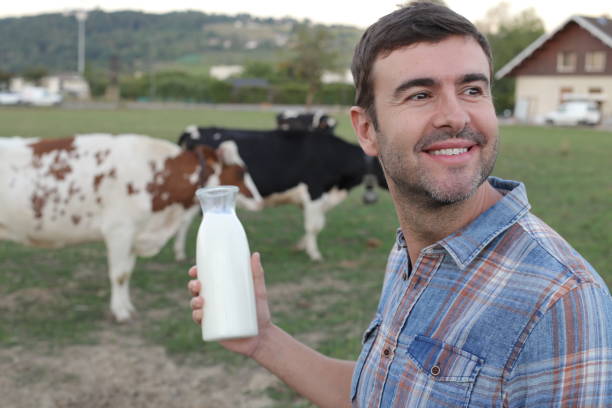 istock Farmer holding fresh bottle of milk 1417888951