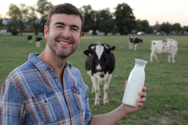 istock Farmer holding fresh bottle of milk 1417889012