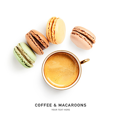 Macaroons cake and cup of coffee creative layout isolated on white background. Valentine day concept. Sweet food composition and design element. Flat lay, top view