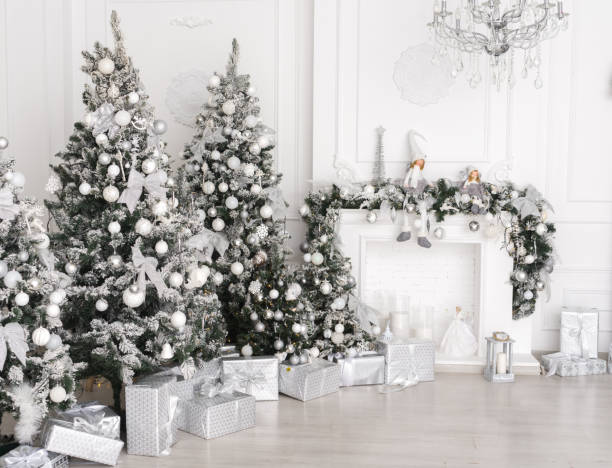 istock White Christmas interior with Christmas tree and fireplace. 1417890041