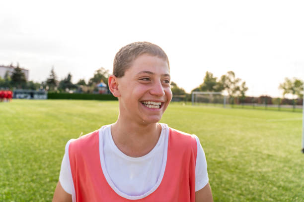 istock Happy boy smiles after winning soccer game 1417891061