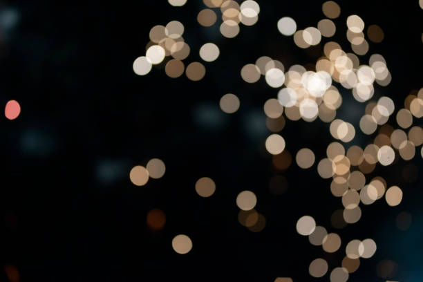istock On a black background bokeh from explosions of colorful fireworks. 1417891192