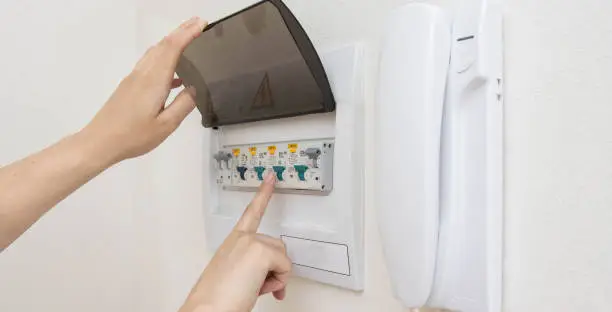 Photo of Electrical switchboard with automatic current switches. The concept of security in the apartment against a short circuit. Close-up