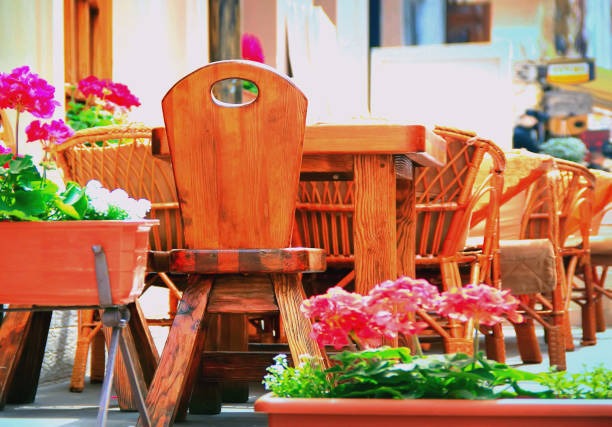 istock Summer cafe wooden table outdoors at the phono flowers 1417897250
