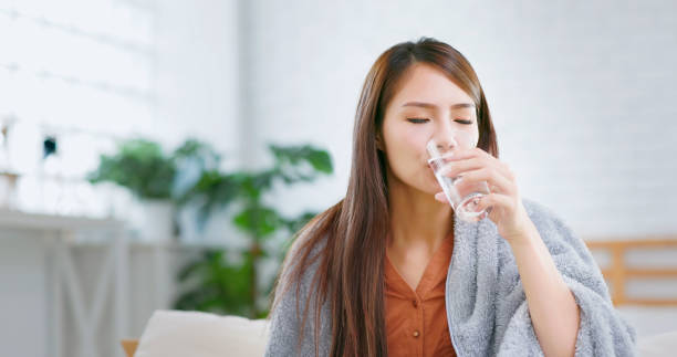 istock woman taking medicine 1417898374