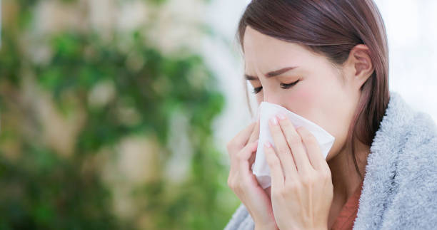 istock woman have running nose 1417898718