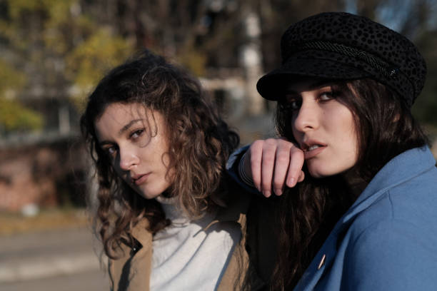 istock Two twin sisters portrait outside in autumn 1417899499