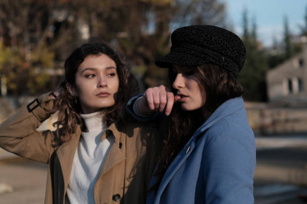 istock Two twin sisters portrait outside in autumn 1417899541