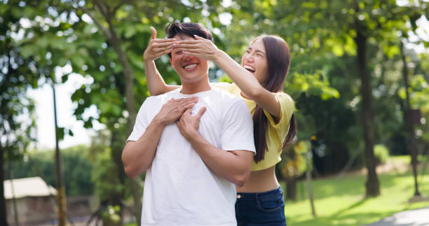 istock asian couple playing in park 1417900756
