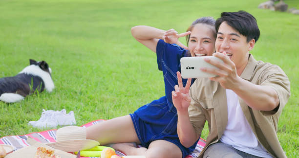 istock couple take selfie with mobile 1417900787