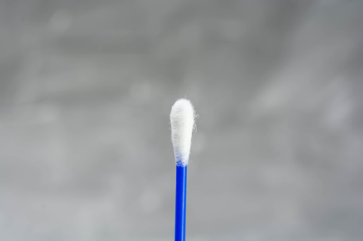 Cotton swab on white background with room for text