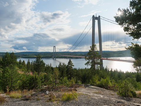 Summer view of the High coast bridge Hogakustenbron seen from the north bank of the river Angermanalven located near Harnosand in Vaesternorrland, Sweden