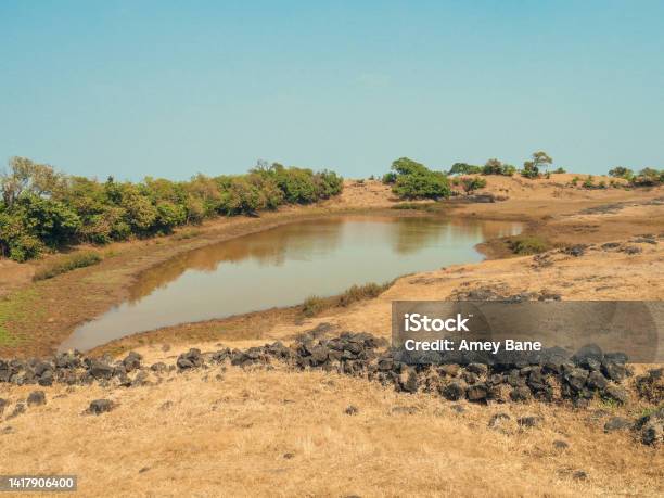 A Water Pond On A Mountain Filled With Muddy Water Stock Photo - Download Image Now - Ancient, Architecture, At The Edge Of