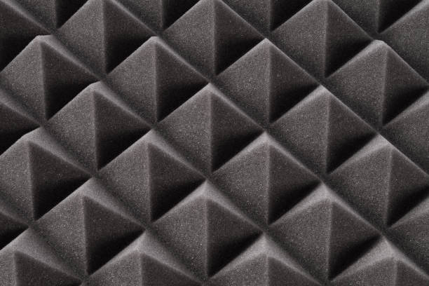 istock Close up of dark gray triangular acoustic and studio sound proof foam pattern texture. Background of noise acoustic foam 1417906843