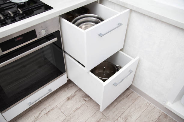 istock Modern drawers in the kitchen for storing utensils. Kitchen making, close-up 1417907194