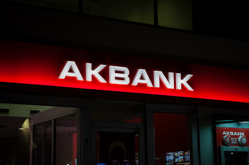 Picture of a sign with the logo of Akbank taken in front of their local bank in Istanbul, Turkey. Akbank T.A.. is one of the largest banks in Turkey. Founded in 1948, As of 2017, it had revenues of nearly TL 13.7 billion. Listed on the Borsa Istanbul, its largest shareholders are members of the Sabanc family. Akbank is a bank that offers vehicle loans, housing loans, consumer loans and commercial loans.