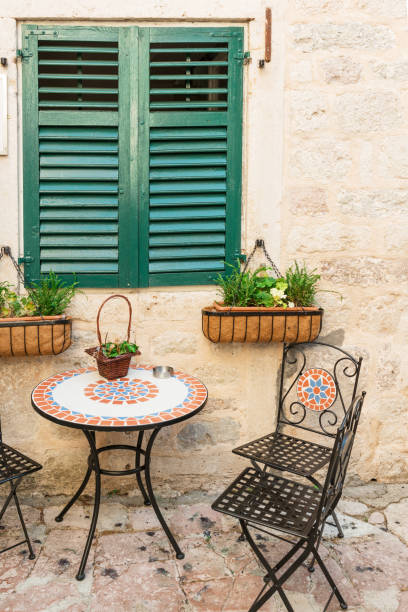 Sidewalk tables of the cozy cafe in medieval Kotor, Montenegro
