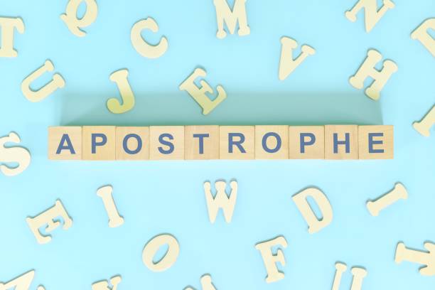 istock Apostrophe figure of speech figurative language concept in English grammar class lesson. Wooden blocks typography flat lay in blue background. 1417908822